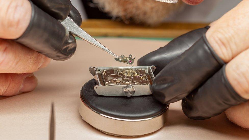 Man assembling a watch