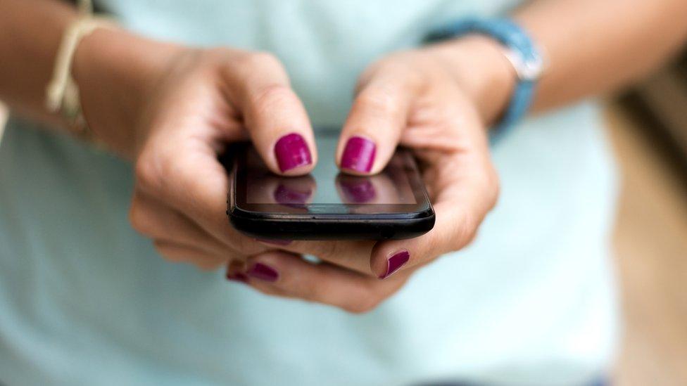 Woman's hands on a smartphone