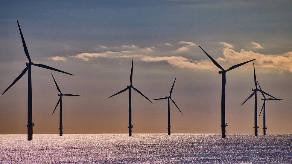 Offshore wind turbines at dusk