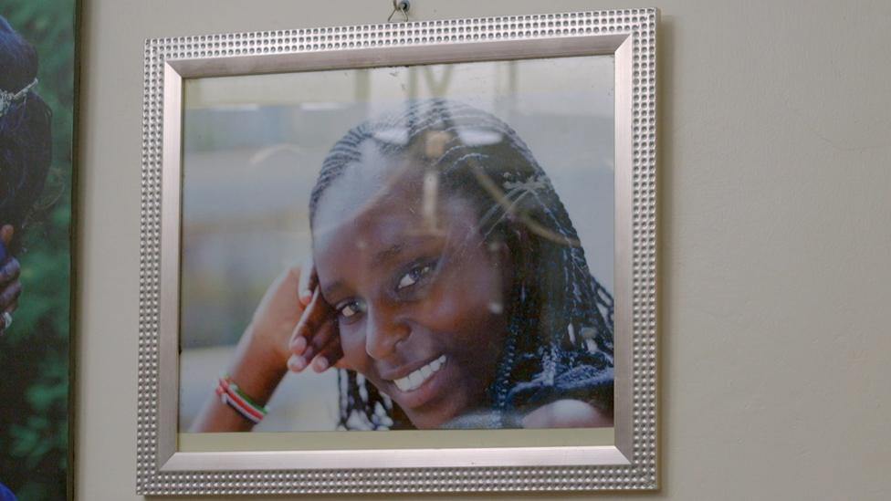 A framed photo of Ebbie Noelle Samuels hanging on a wall