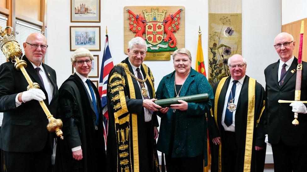 Val and four men in ceremonial robes