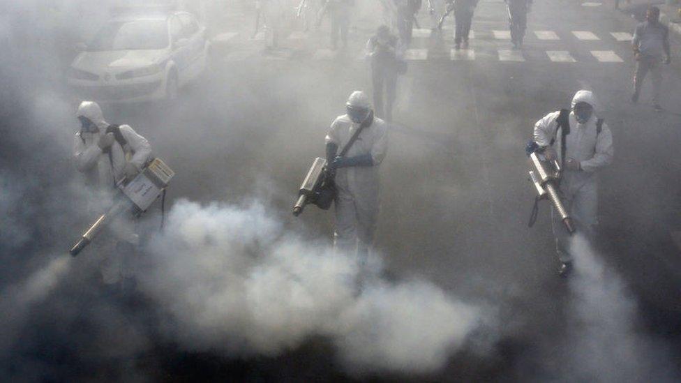 Iranian firefighters disinfect streets in Tehran to halt the wild spread of coronavirus in March 2020