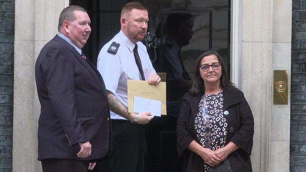 Figen Murray delivering a letter to Downing Street