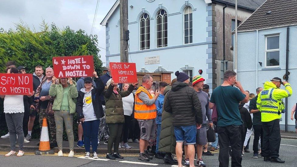 Protesters outside the site