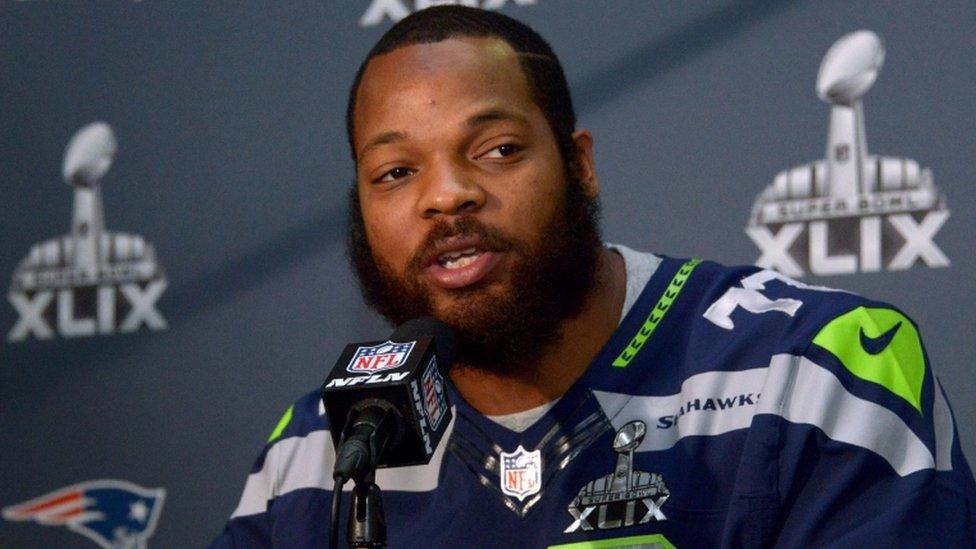 Michael Bennett speaking at a news conference