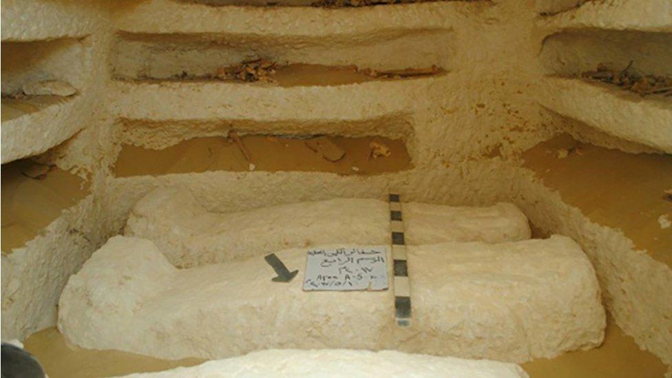 A handout picture released by the Egyptian Antiquities Ministry on 15 August 2017 shows three ancient tombs containing sarcophagi which were discovered in a cemetery dating back about 2,000 years in the al-Kamin al-Sahrawi area in Minya province, south of Cairo.