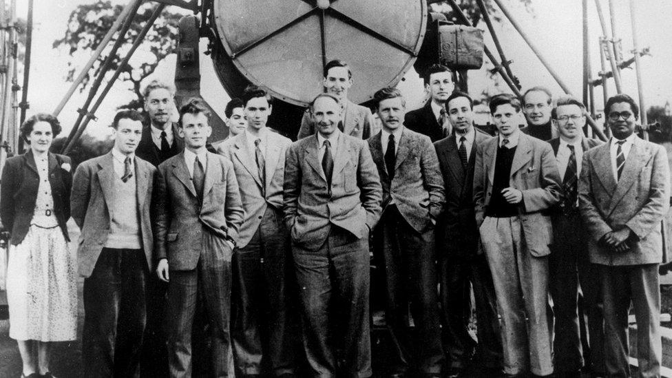 Sir Bernard Lovell and the Jodrell Bank research team in front of the Searchlight Ariel