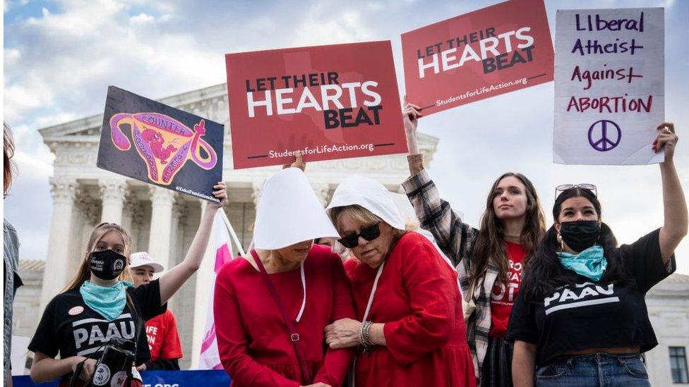 Protesters on both sides held rallies outside the court on Monday