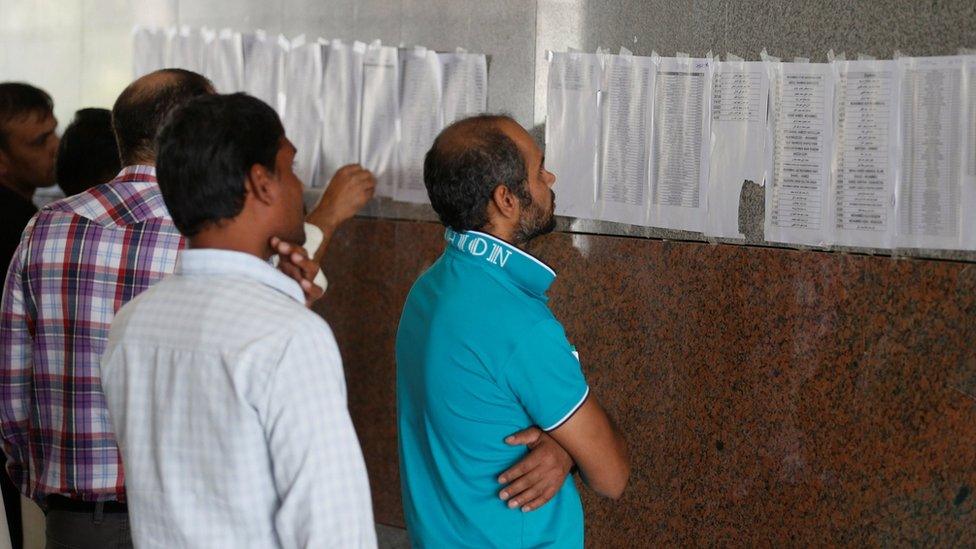 Migrant workers, who work for the Saudi Binladin Group, gather as they ask for a final settlement over a salary issue in Riyadh, Saudi Arabia, March 29