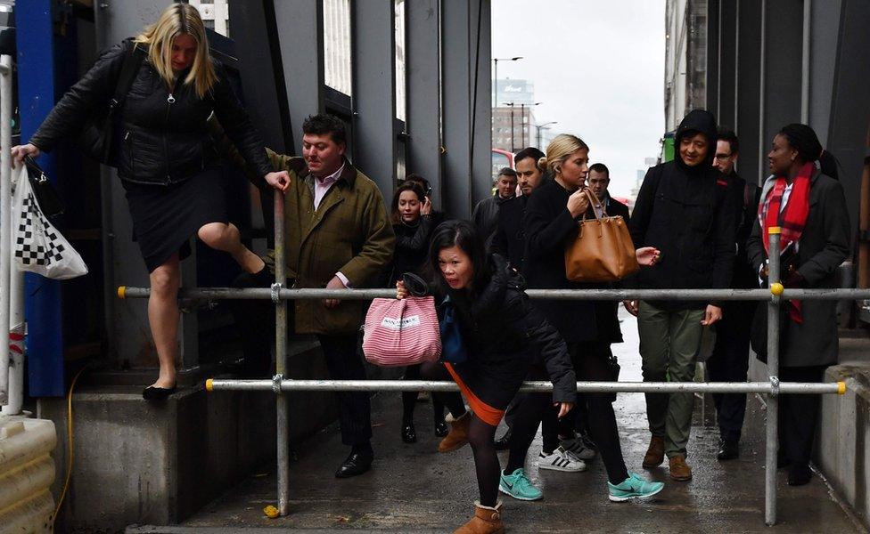 Commuters take a shortcut at London Bridge on Monday morning