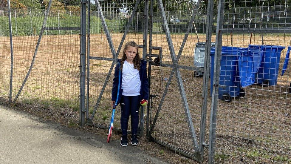 Child at tennis courts