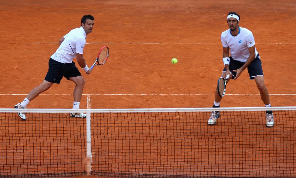 Daniele Bracciali of Italy and Potito Starace of Italy in action in the doubles against Max Mirnyi of Belarus and Mikhail Youzhny of Russia during day three of the Internazionali BNL d'Italia tennis 2014 on May 13, 2014