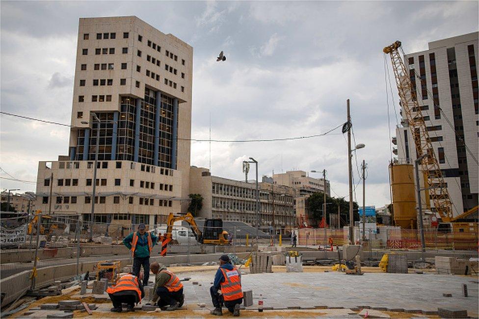 Workers on a construction site in central Tel Aviv, Israel, on Thursday, March 10, 2022.