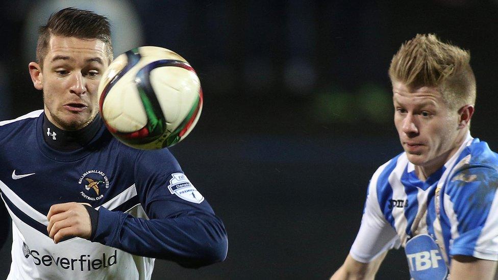 Liam Martin of Ballinamallard United goes for the ball with Coleraine's Lyndon Kane at the Showgrounds