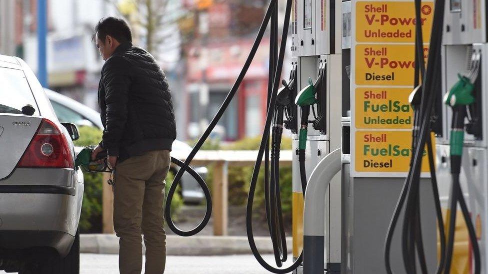 Man at petrol pump