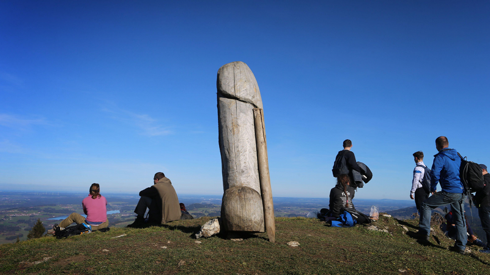 A family goes for a walk on a hill in Bavaria