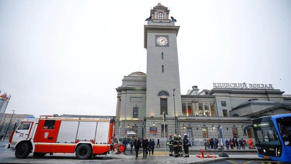 Fire engine and emergency workers outside