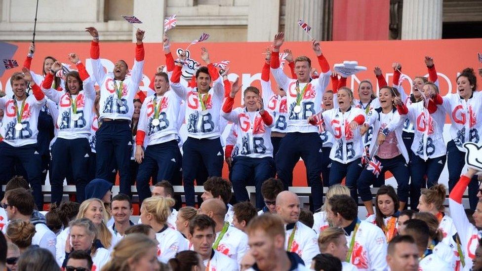 Team GB athletes start a Mexican wave on stage at Trafalgar Square