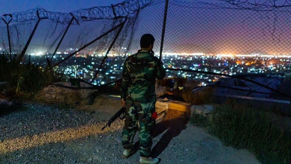 Afghan soldiers stayed behind guarding their post on Wazir Akbar Khan Hill for one last night in Kabul, Afghanistan, Sunday, Aug. 15, 2021.