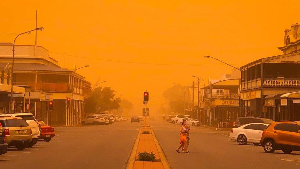 A main street in Broken Hill turned orange by a dust storm