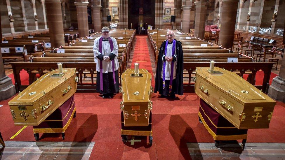 The three coffins inside the church