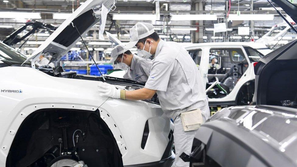 Chinese workers assemble Toyota SUVs on the assembly line at a plant of FAW-Toyota in Changchun City, northeast China's Jilin Province.