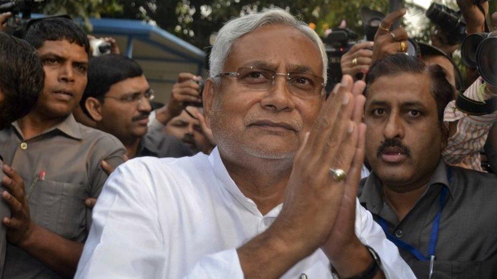 Bihar Chief Minister Nitish Kumar greets supporters after victory in Bihar state elections in Patna, India, Sunday, Nov. 8, 2015.