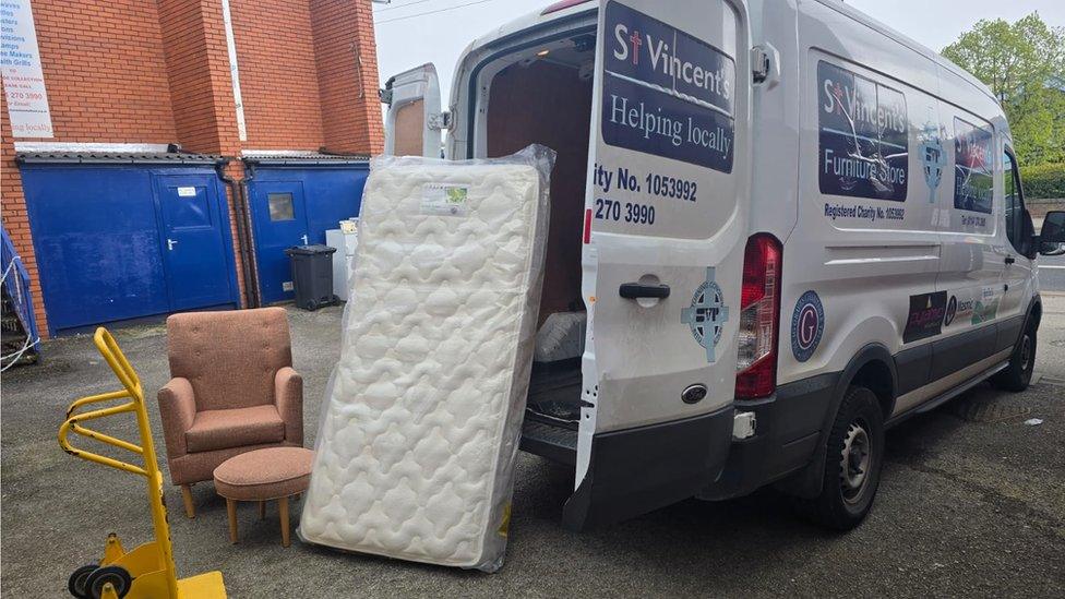 A mattress leaning against a lorry