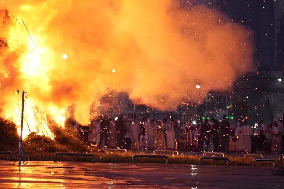 Bonfire next to crowd