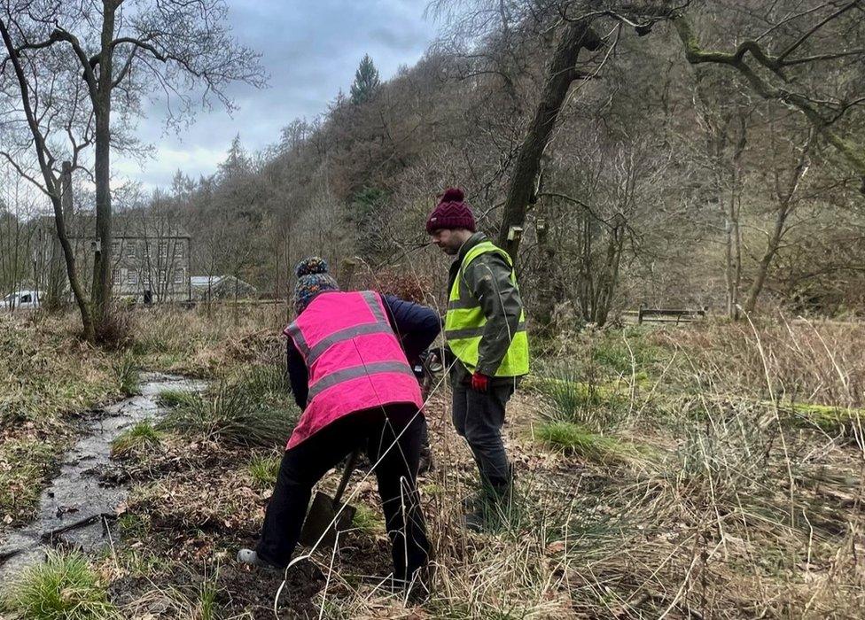 Volunteers creating flood defences