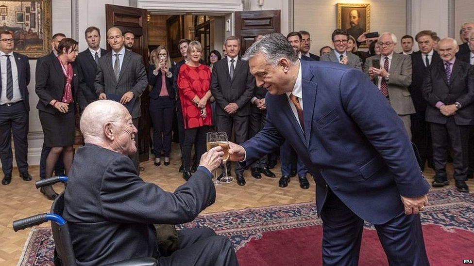 Sir Roger Scruton receiving the Hungarian Order of Merit from the country's prime minister Viktor Orban