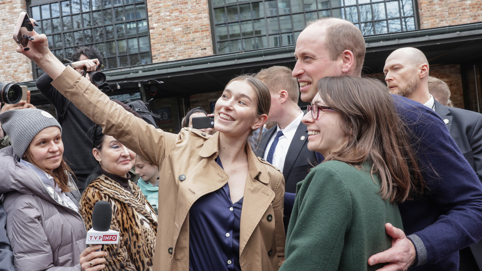 People taking selfies with Prince William