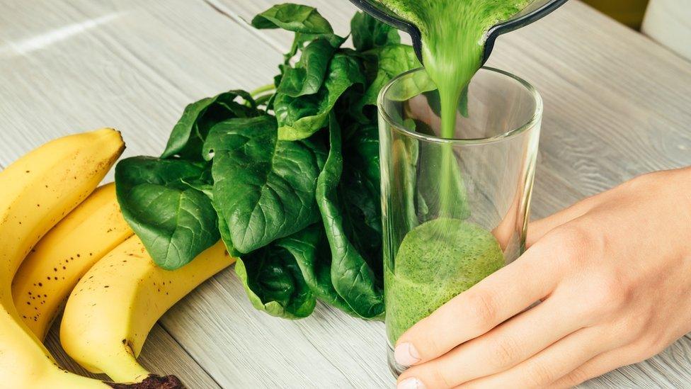 glass of green blended juice