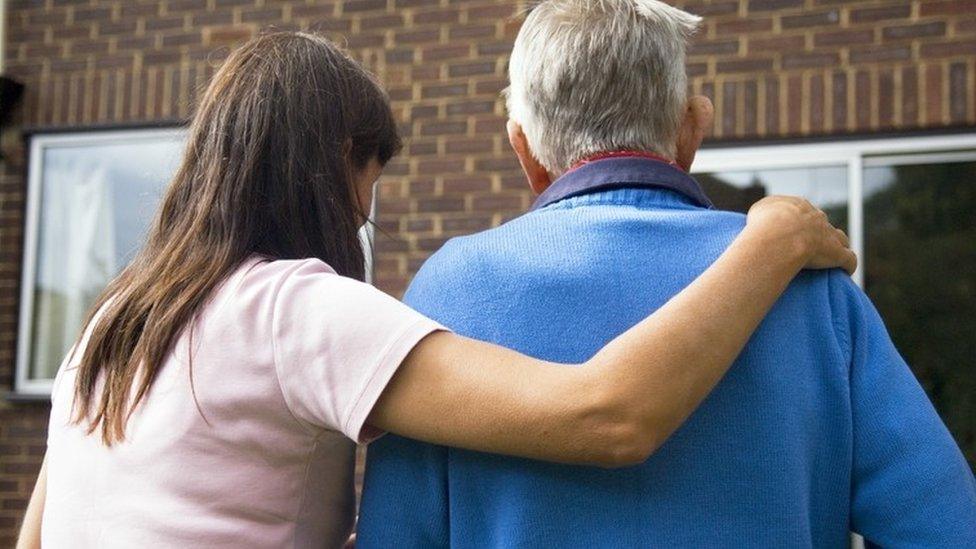 Adult social care worker with elderly man