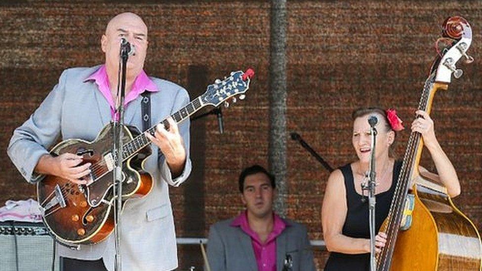 A band performing on the Main Stage in Mariners Square during Gloucester Goes Retro 2022