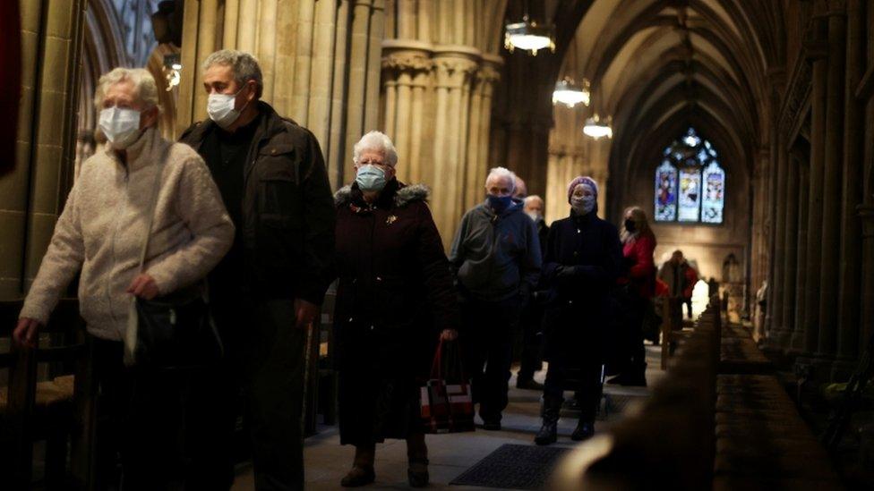 People queue to receive COVID 19 vaccines inside Lichfield Cathedral