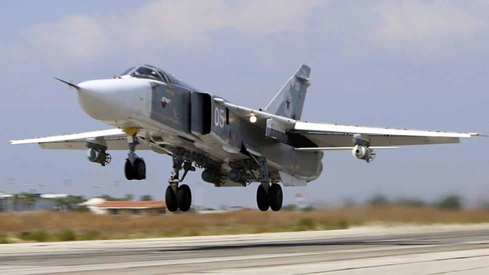 Russian Su-24M jet fighter armed with laser guided bombs takes off from a runaway at Hmeimim airbase in Syria.