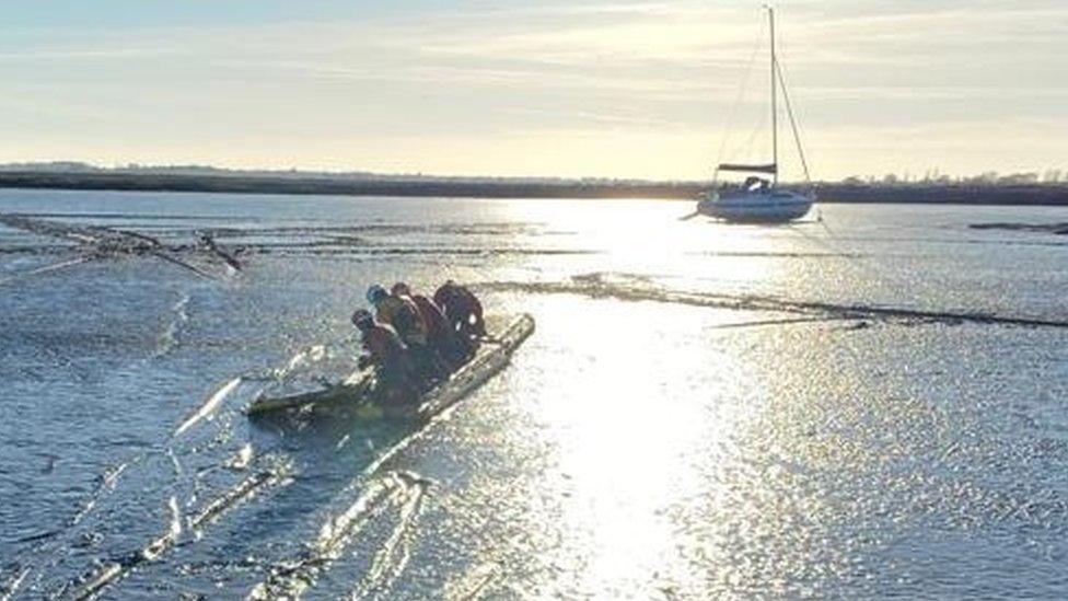 A yacht stuck in mudflats in Essex