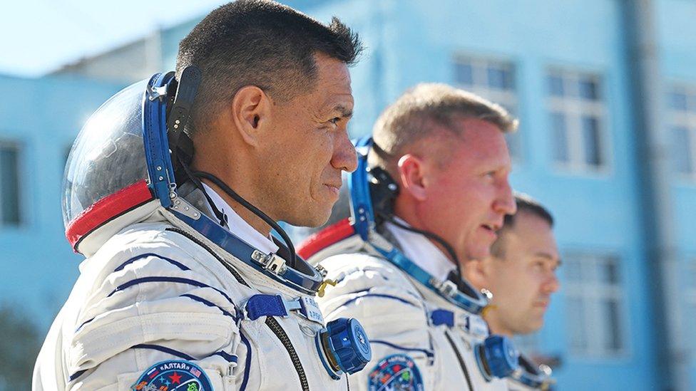 Russian cosmonauts Sergey Prokopyev (C) and Dmitri Petelin (R) and NASA astronaut Frank Rubio, members of the International Space Station (ISS) Expedition 68 main crew, report to Russia's Roscosmos space agency head prior to the launch at the Russian leased Baikonur cosmodrome in Kazakhstan on September 21, 2022