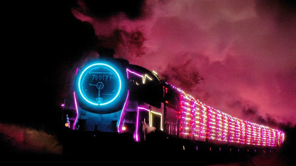 Watercress Line train covered in lights