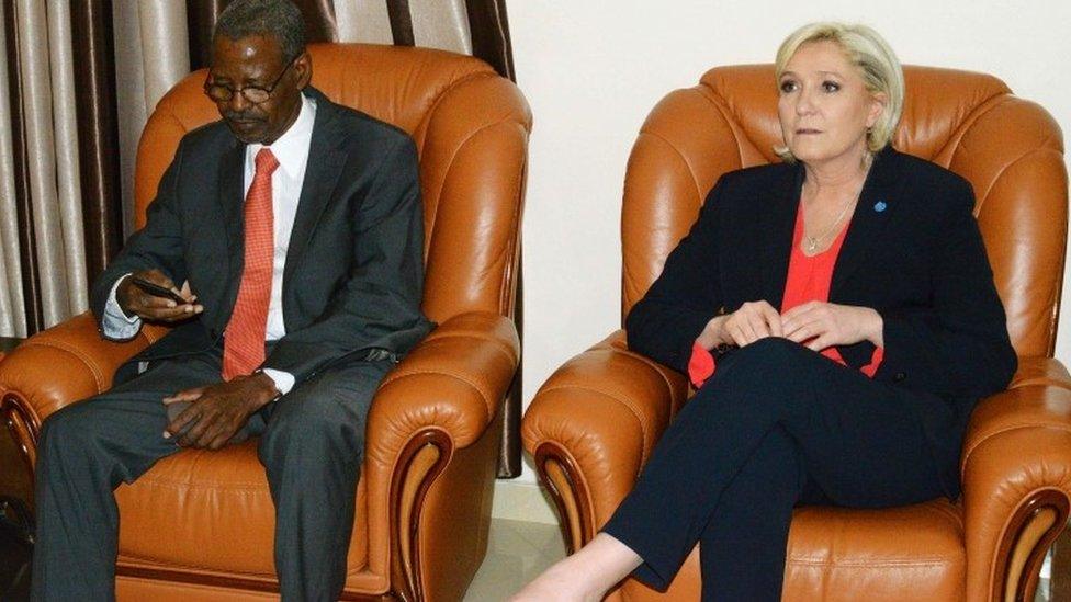 French far-right Front National (FN) party candidate for the presidential election Marine Le Pen (R) sits next to Chadian president cabinet director Mahamat Hissein