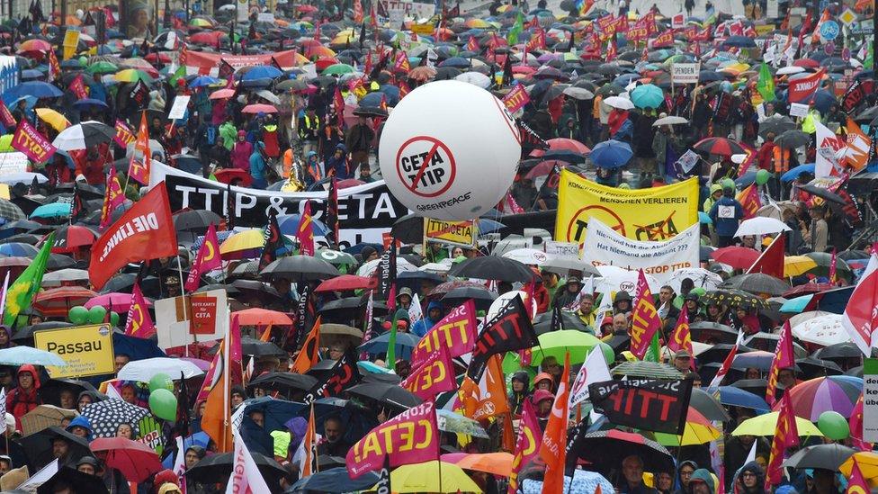 Demonstrators protest against the massive transatlantic trade deals CETA and TTIP on 17 September 2016 in Munich, southern Germany.