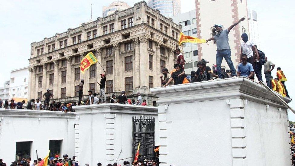 Protestors demanding the resignation of Sri Lanka's President Gotabaya Rajapaksa gather inside the compound of Sri Lanka's Presidential Palace in Colombo on July 9, 2022