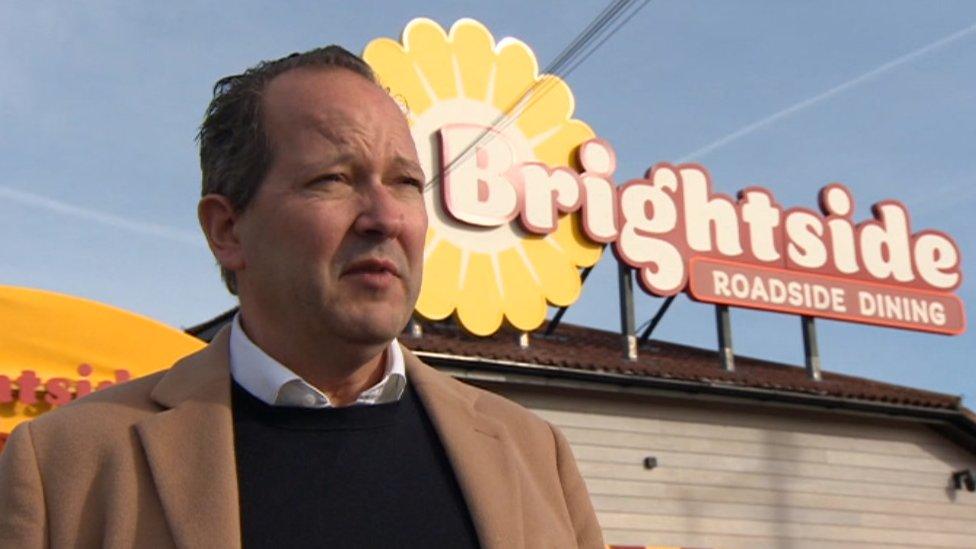 A man outside a diner