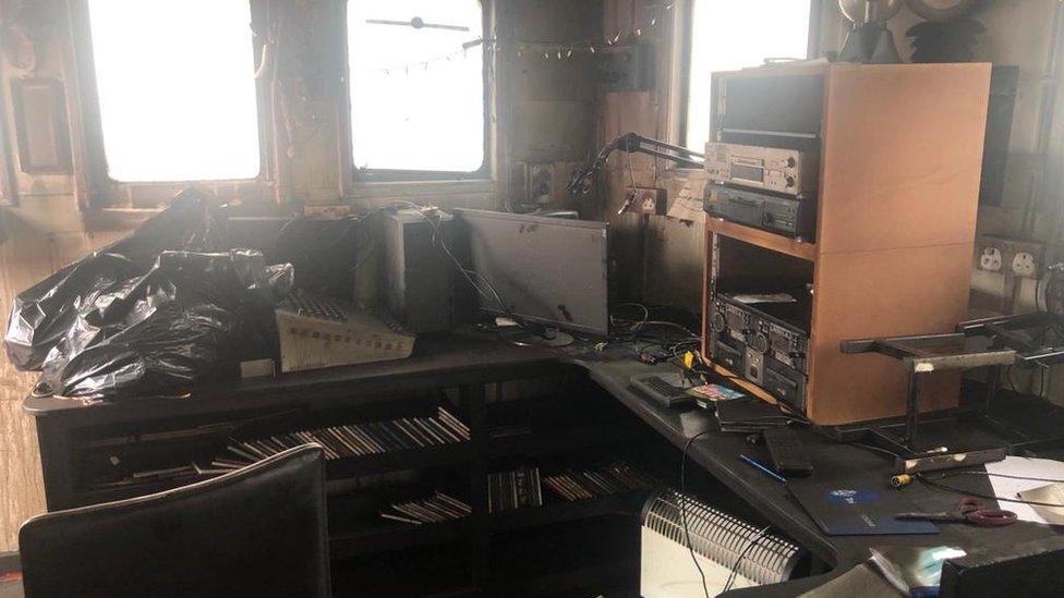 The studio onboard the boat, damaged by smoke