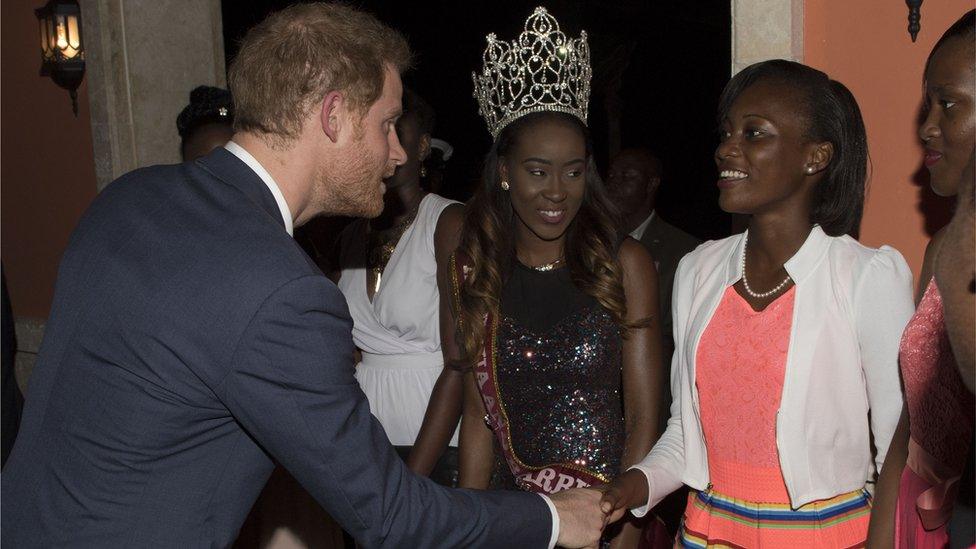 Prince Harry shakes hands with guest