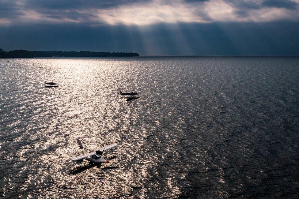 Seaplanes are pictured on Lake Geneva prior to taking off during a meeting of the Swiss Association of Seaplane Pilots (SPAS) in Perroy, Switzerland, 24 June 2017