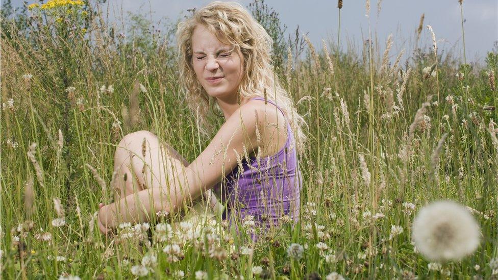 Woman sitting in grass