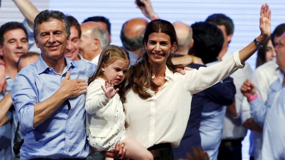 Mauricio Macri, his wife Juliana Awada and their daughter Antonia gesture to their supporters after the presidential election in Buenos Aires on 22 November, 2015.