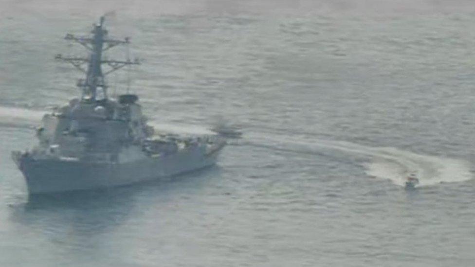 Handout photo from US Navy showing Iranian Islamic Revolutionary Guard Corps Navy (IRGCN) vessels near the USS Paul Hamilton in the Gulf (15 April 2020)